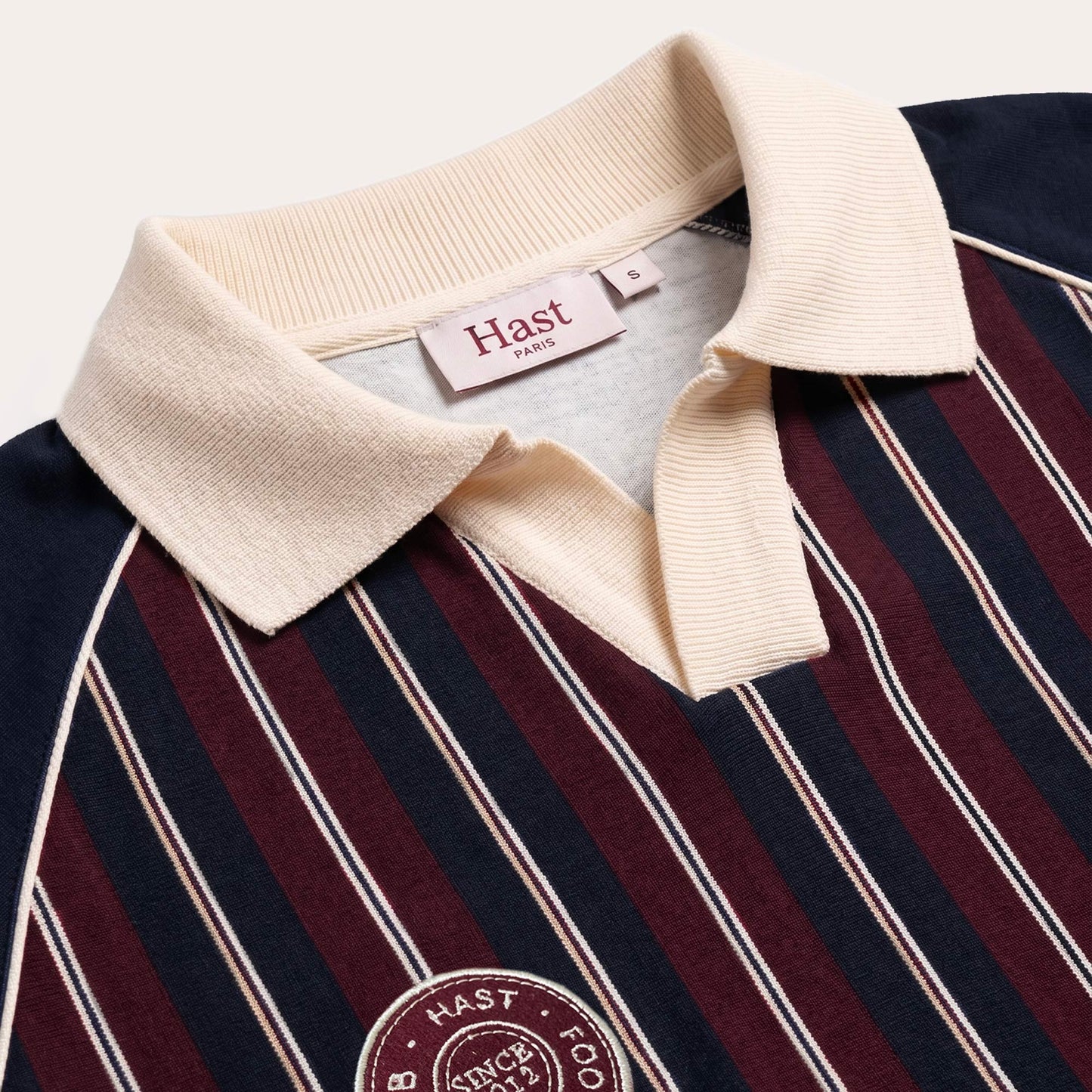 Navy football jersey with burgundy stripes