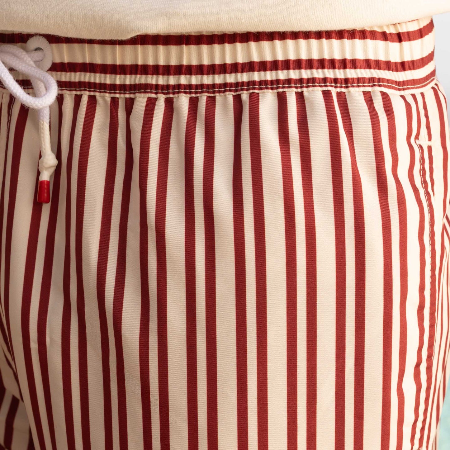 Ecru swimsuit with burgundy stripes in Seaqual®