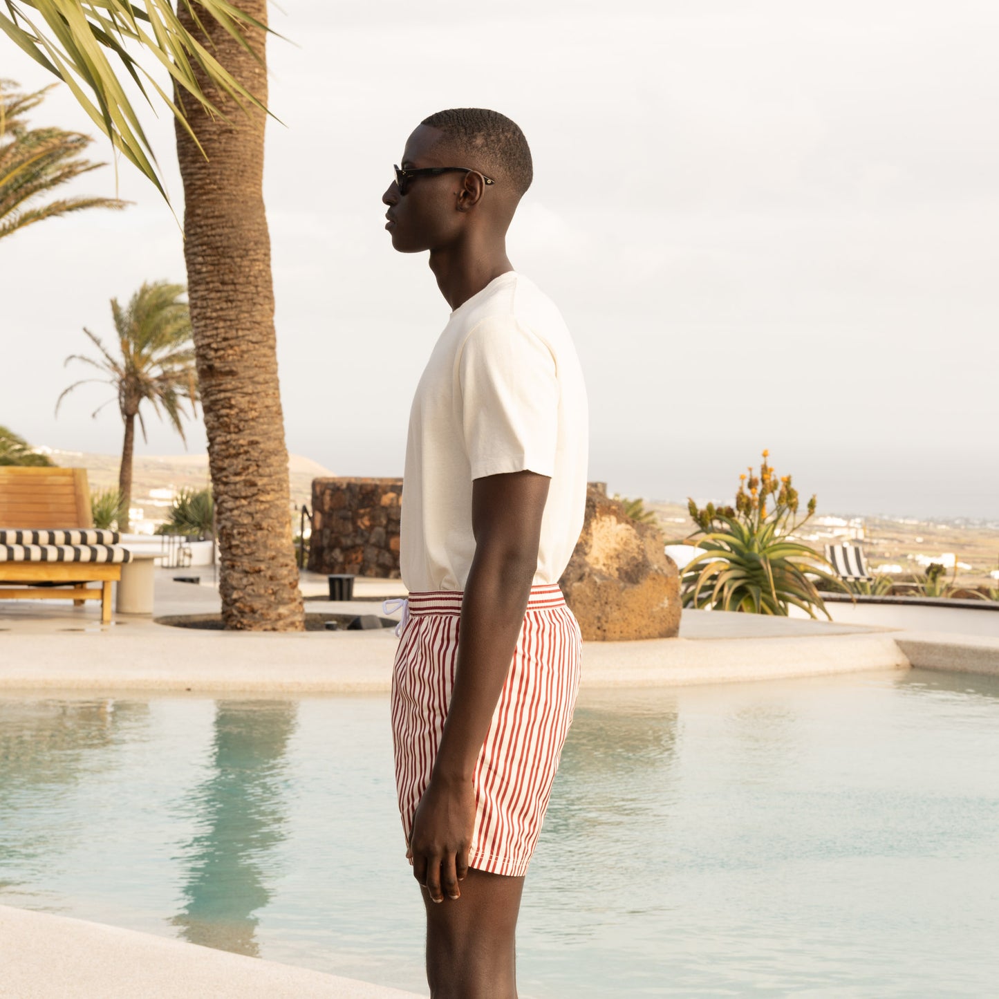 Ecru swimsuit with burgundy stripes in Seaqual®