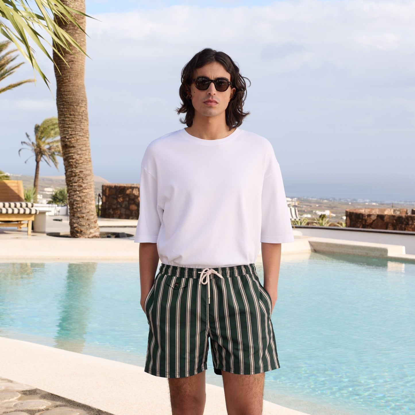 Green swimsuit with white stripes