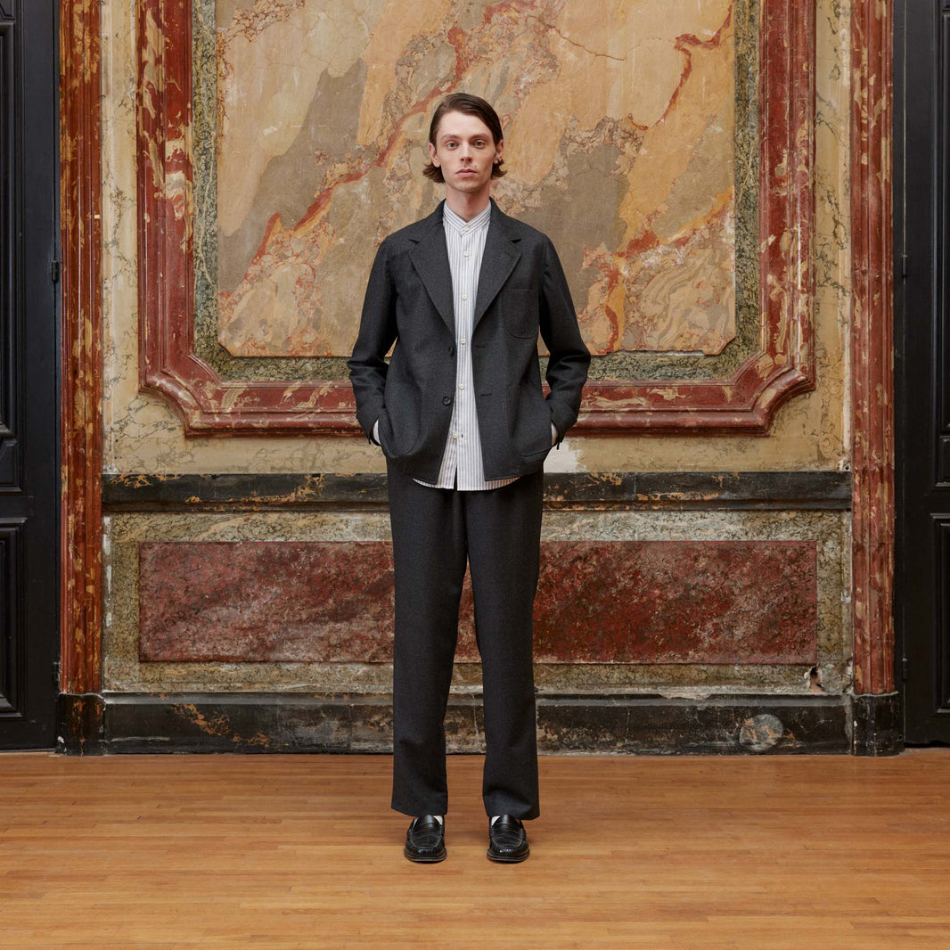 Deconstructed tailored jacket in gray wool flannel