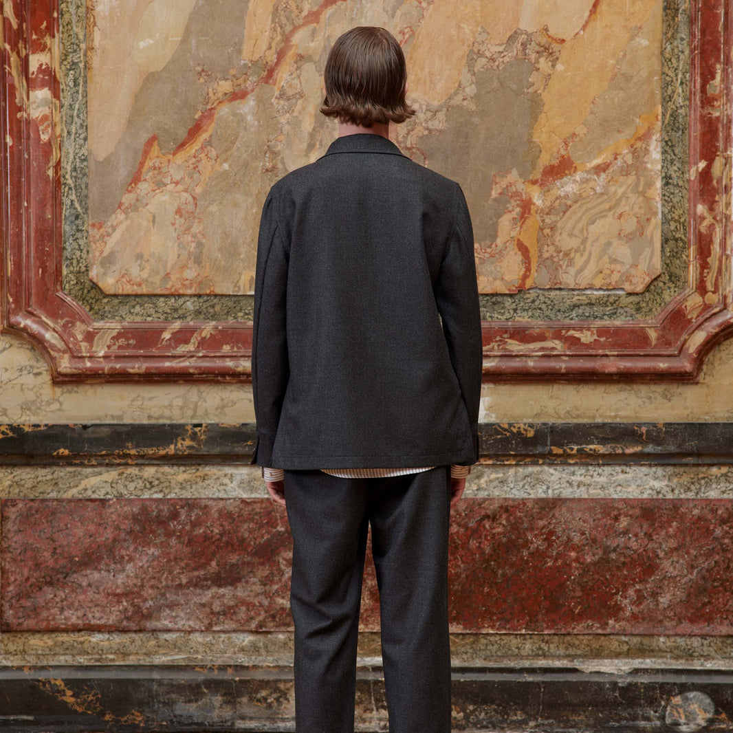 Deconstructed tailored jacket in gray wool flannel