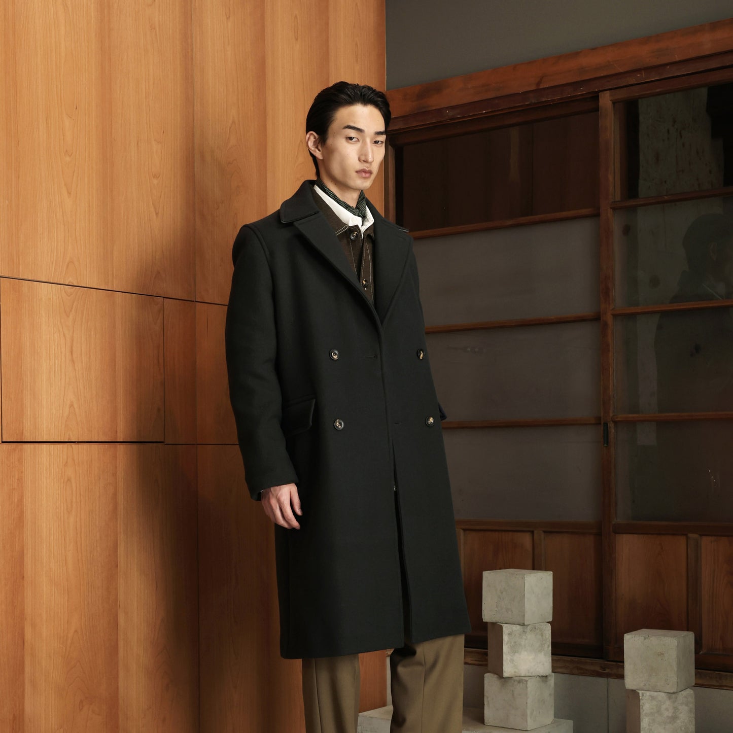 Double-breasted coat in green wool