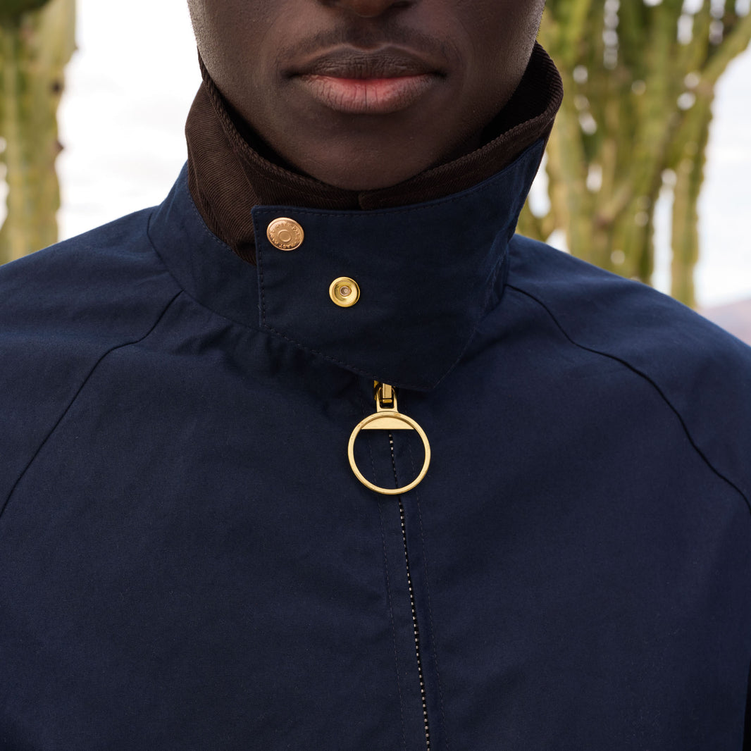 Blouson en coton ciré bleu col velours marron