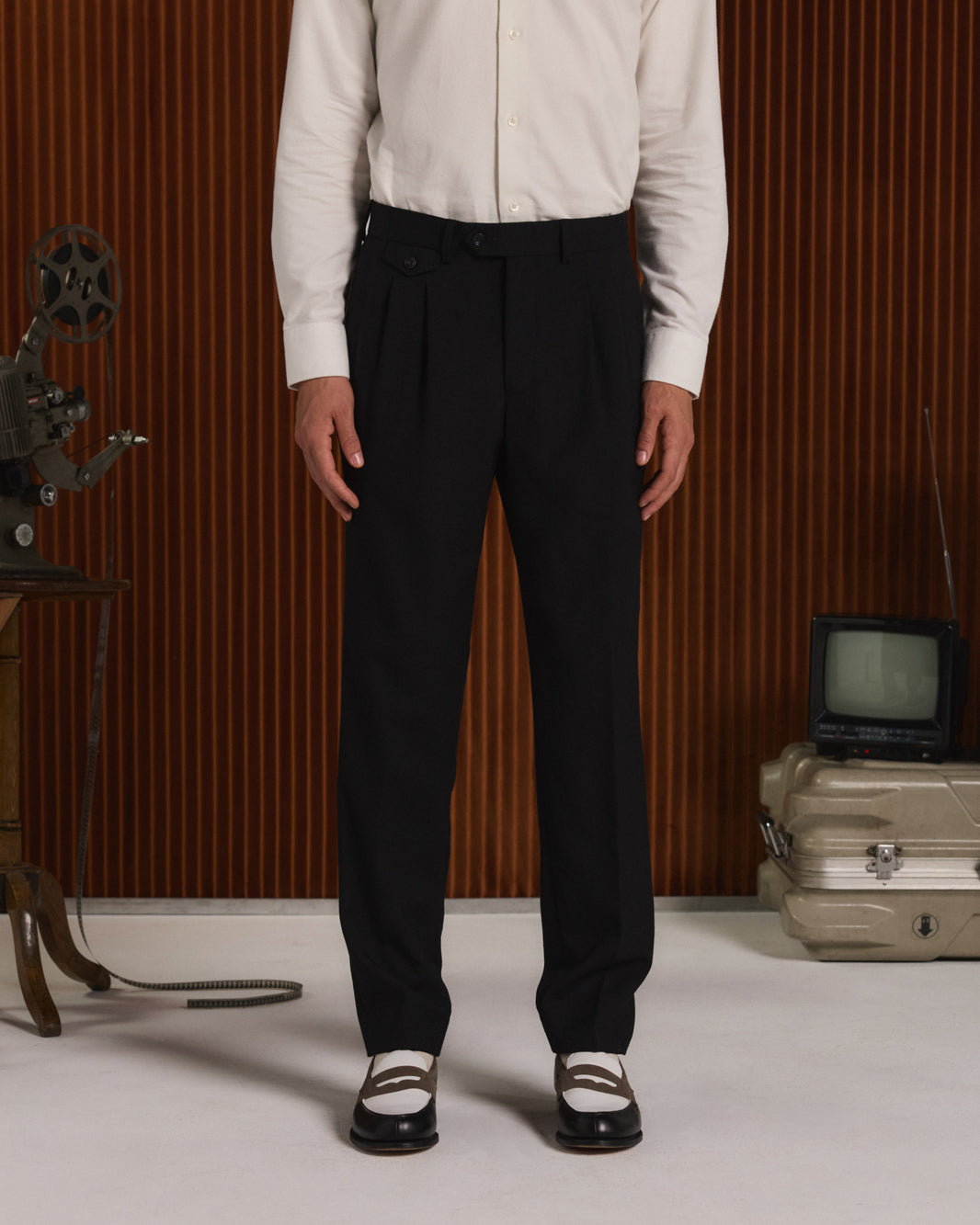 Black wool flannel pleated trousers