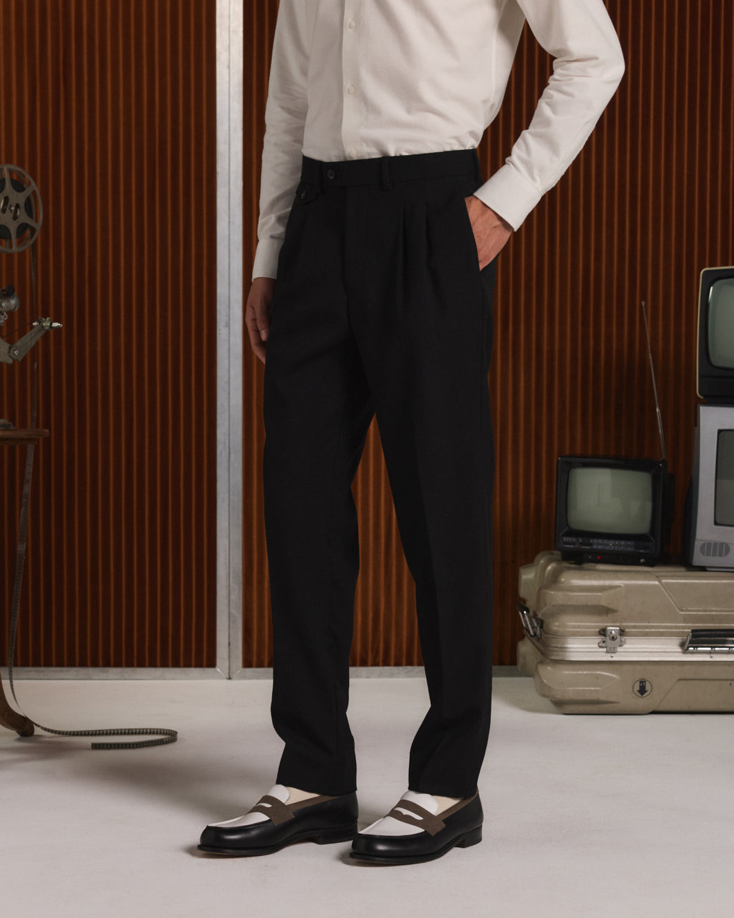 Black wool flannel pleated trousers