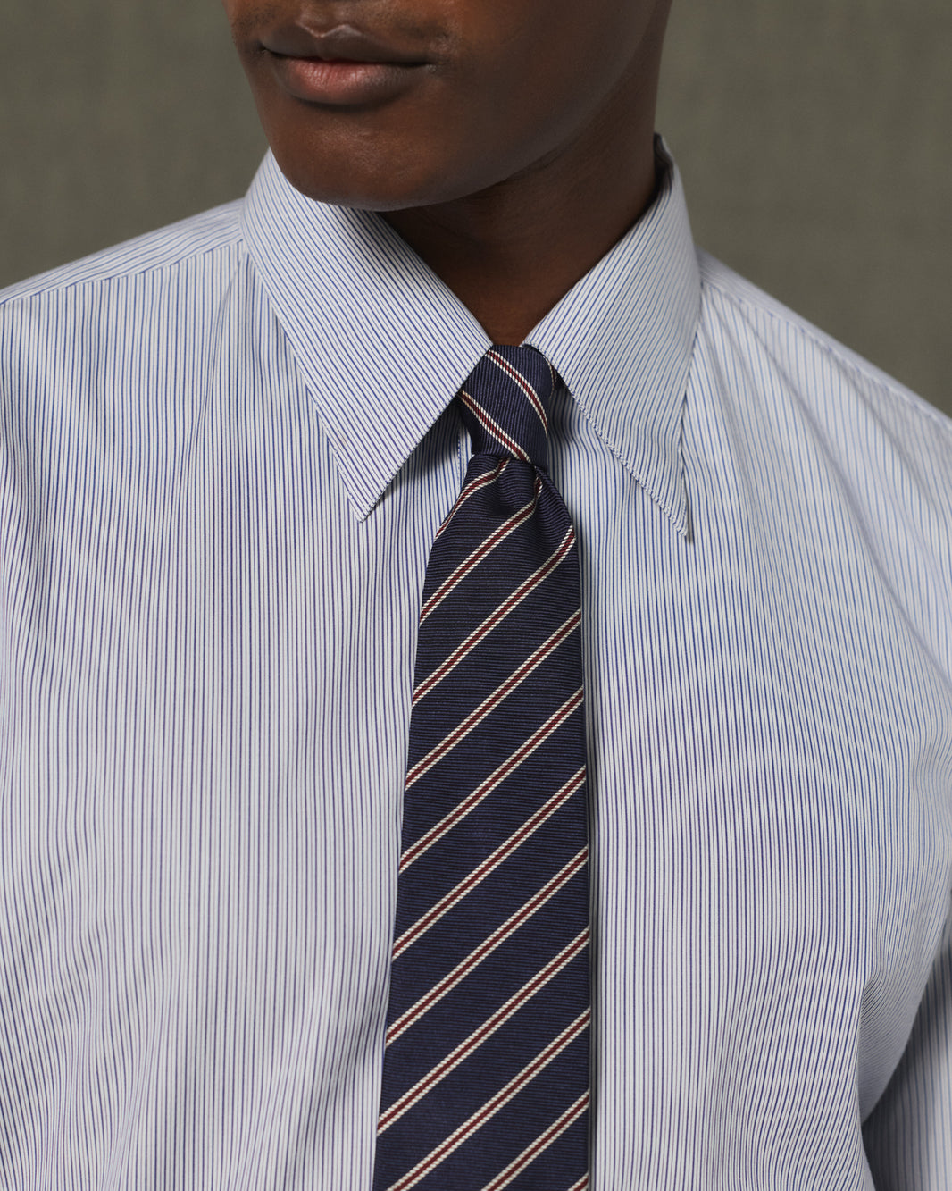Navy silk tie with a burgundy stripe